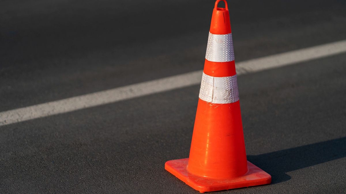 Traffic cone,an image of cautions on asphalt road