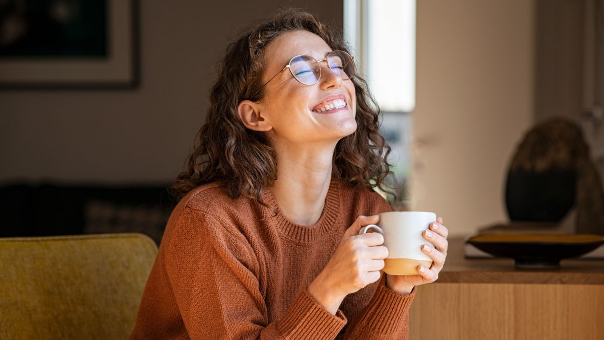 Portrait,Of,Joyful,Young,Woman,Enjoying,A,Cup,Of,Coffee