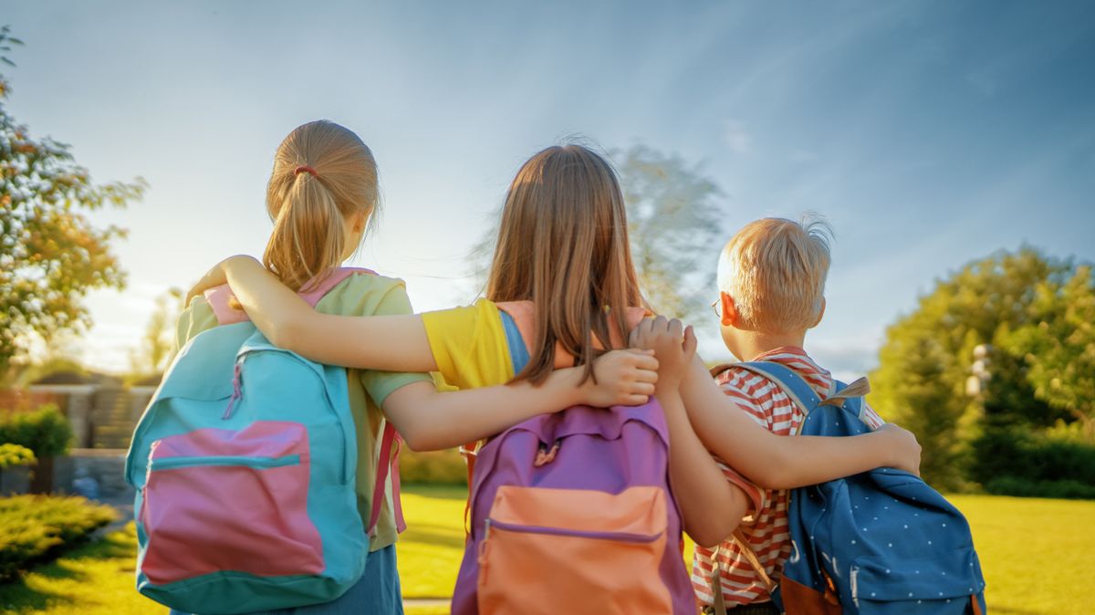 Pupils,Of,The,School.,Girls,And,Boy,With,Backpacks,Outdoors.