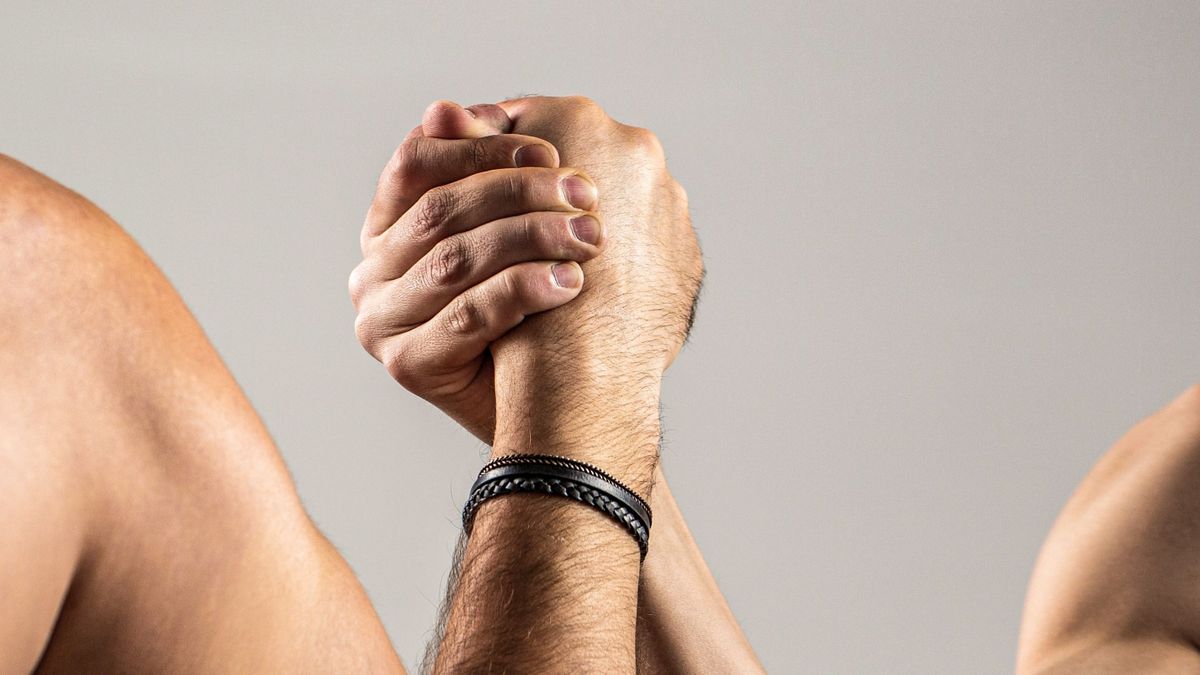 Arms,Wrestling,Thin,Hand,,Big,Strong,Arm,In,Studio.,Two