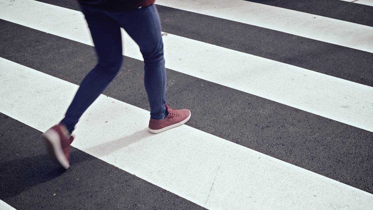 Young,Woman,Crossing,A,Zebra,Crossing.