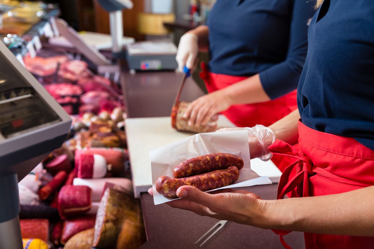 Sales,Women,In,Butcher,Shop,Selling,Meat,And,Sausages,,Close-up