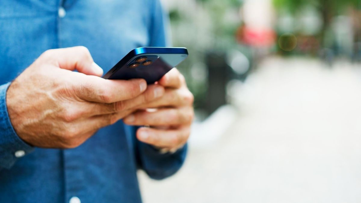 Close up of man using smart phone