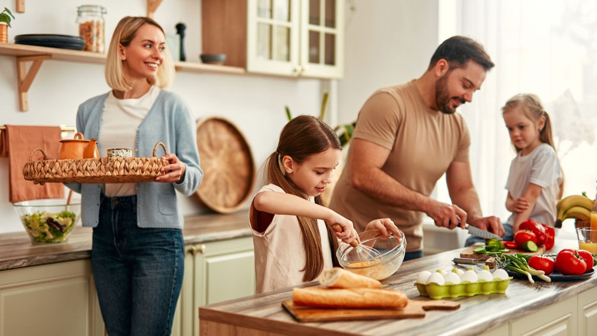 A,Happy,Family,Is,Cooking,Together,In,A,Bright,Kitchen,