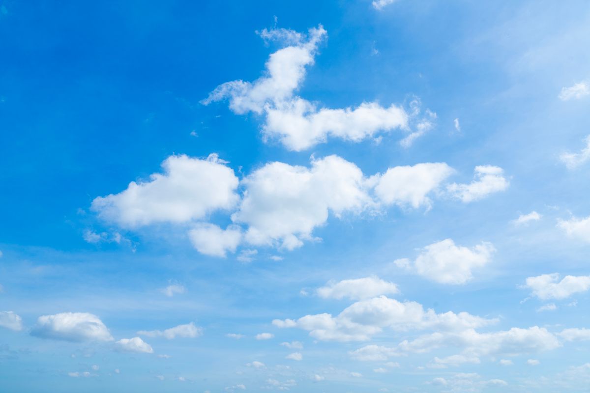 Beautiful Blue Sky with Fluffy White Clouds on a Clear Day