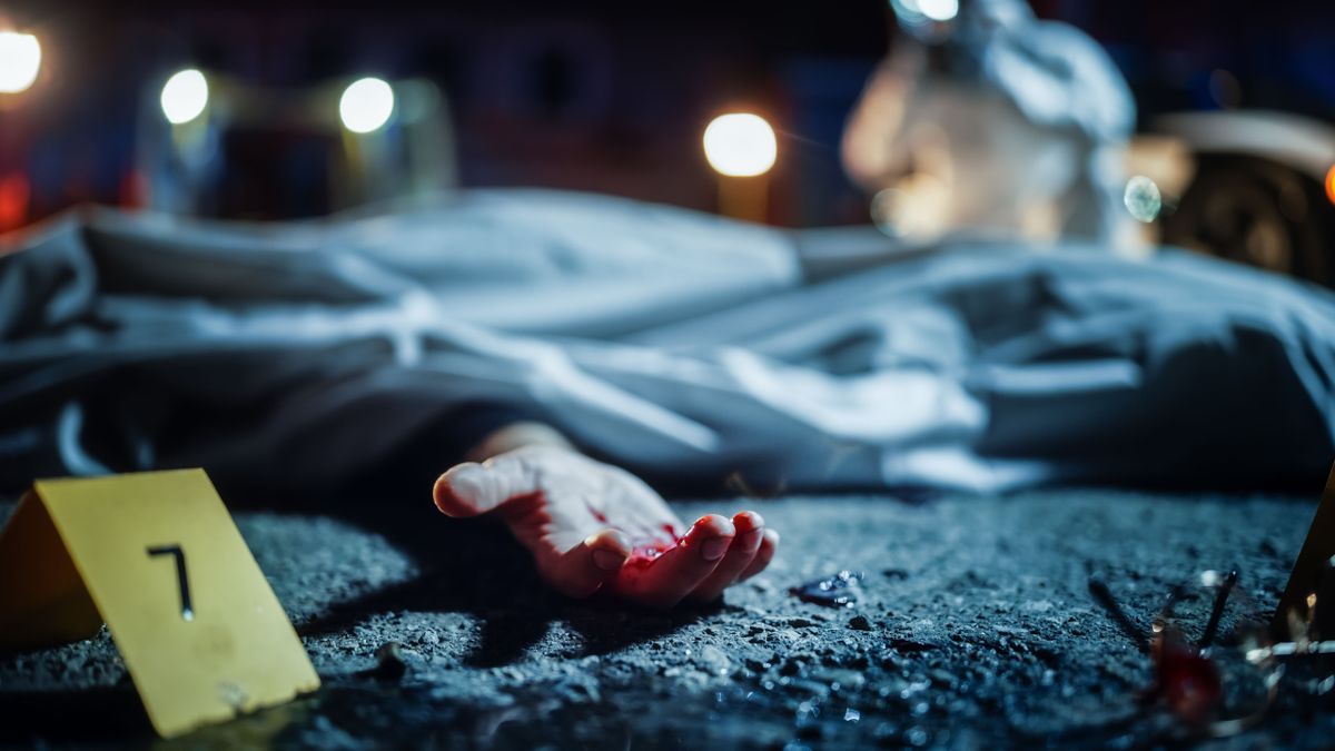 Bloody,Hand,Of,A,Dead,Body,Peeking,Out,Of,Cloth