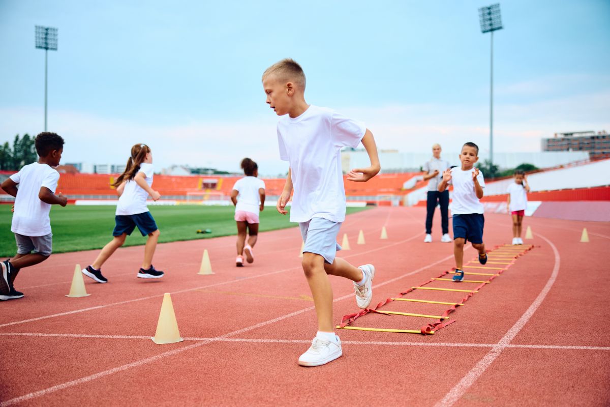 Group,Of,Kids,Having,Kids,Pe,Class,At,The,Stadium.